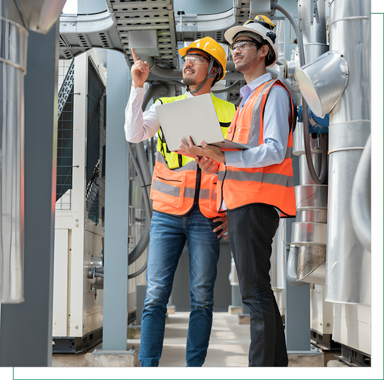 Workers in safety vests discussing machinery