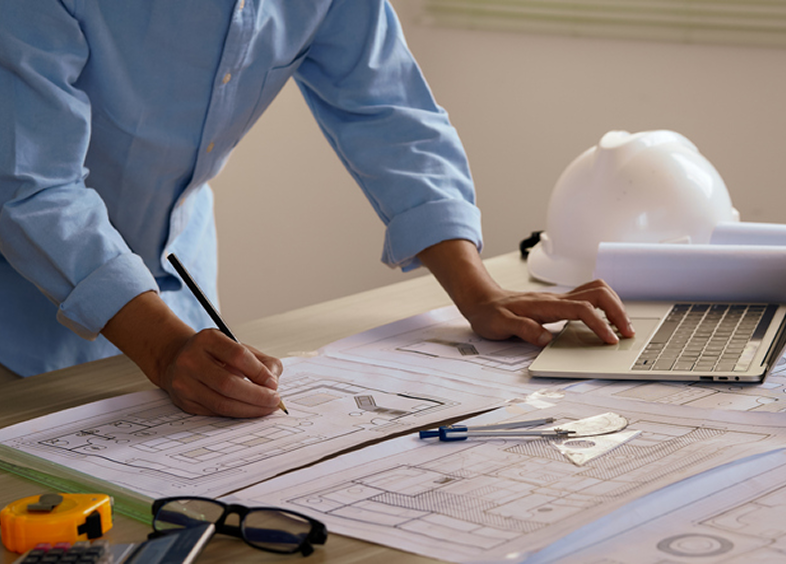 Architect working on building plans