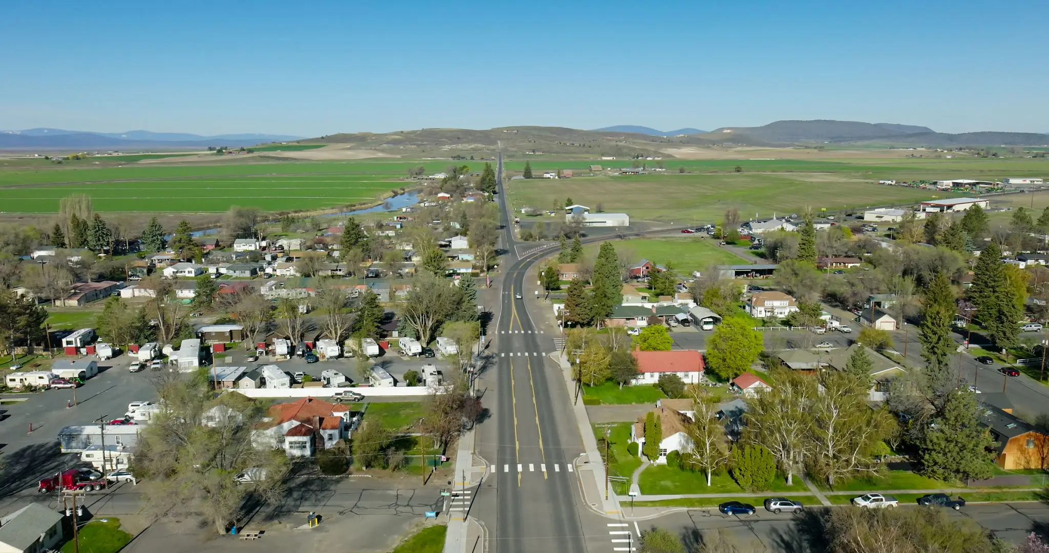Aerial view of rural town and fields.